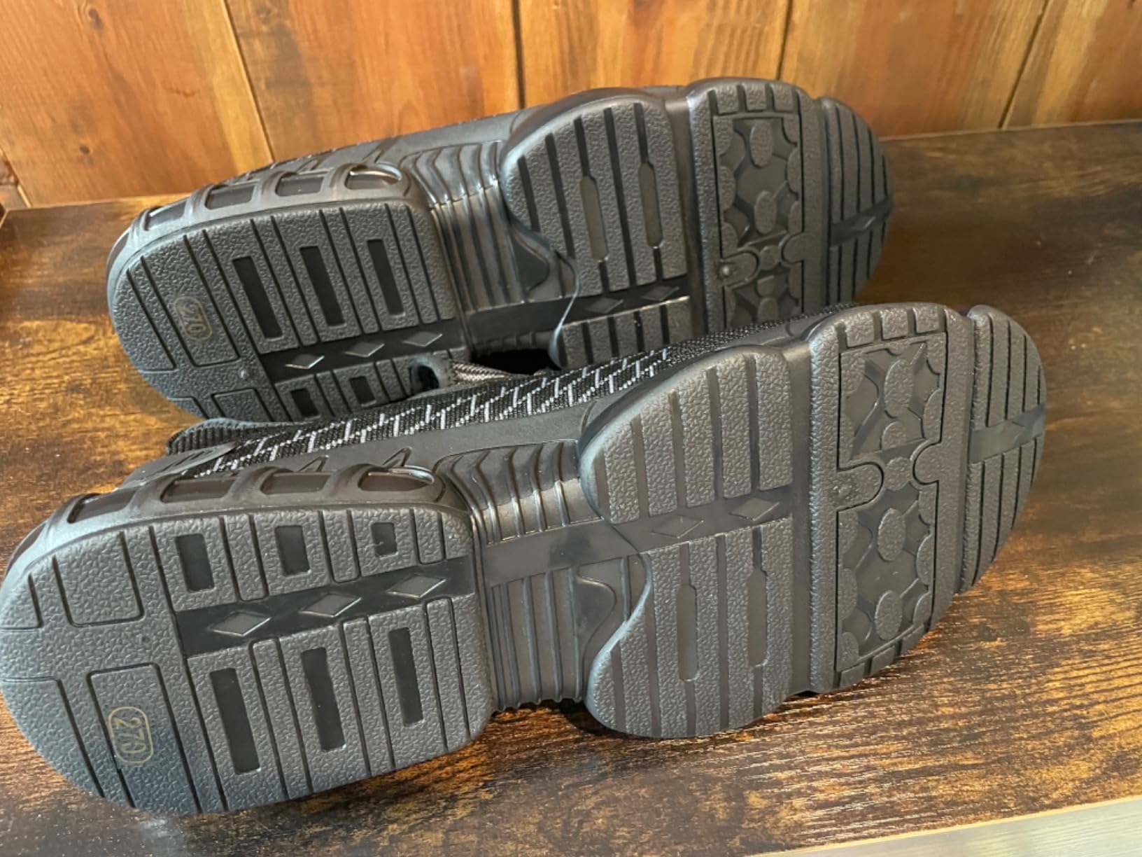 Construction worker wearing steel toe work shoes on active job site showing real-world use