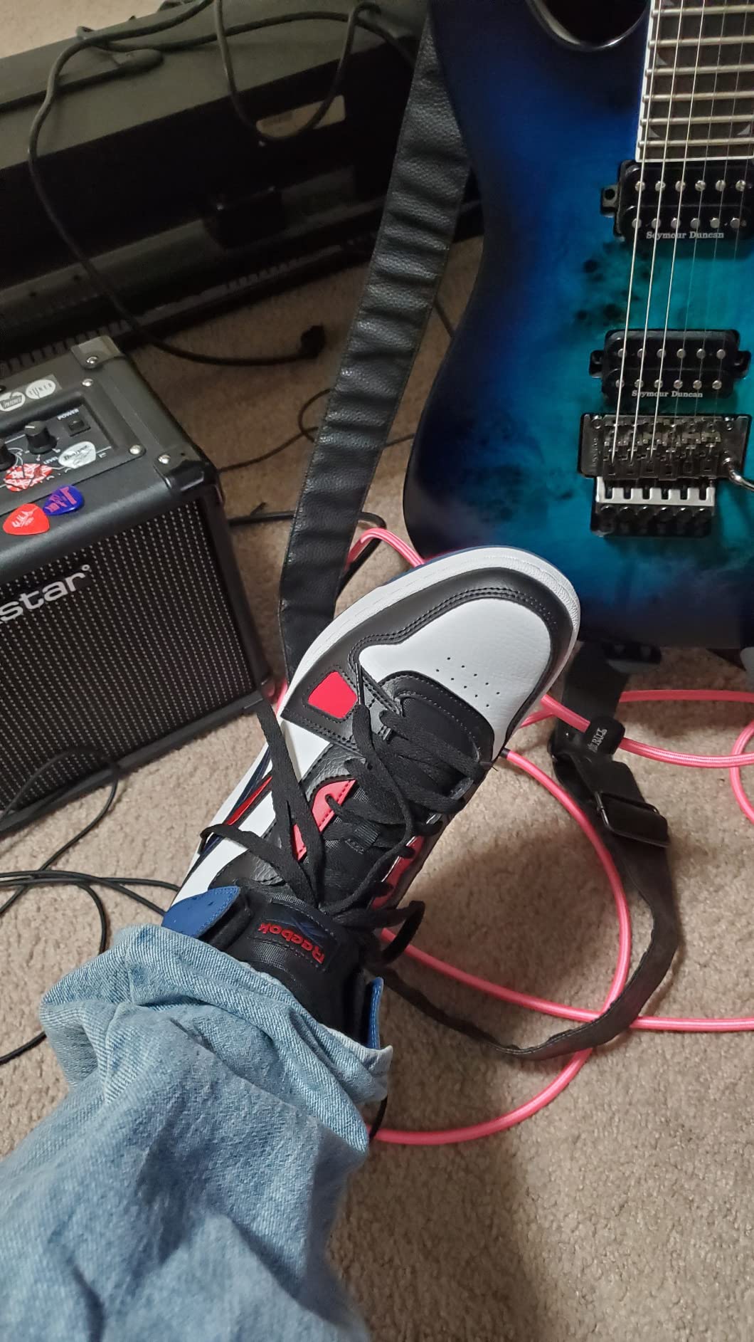 Reebok Resonator Mid basketball shoes black colorway showing retro mid-top silhouette and classic design