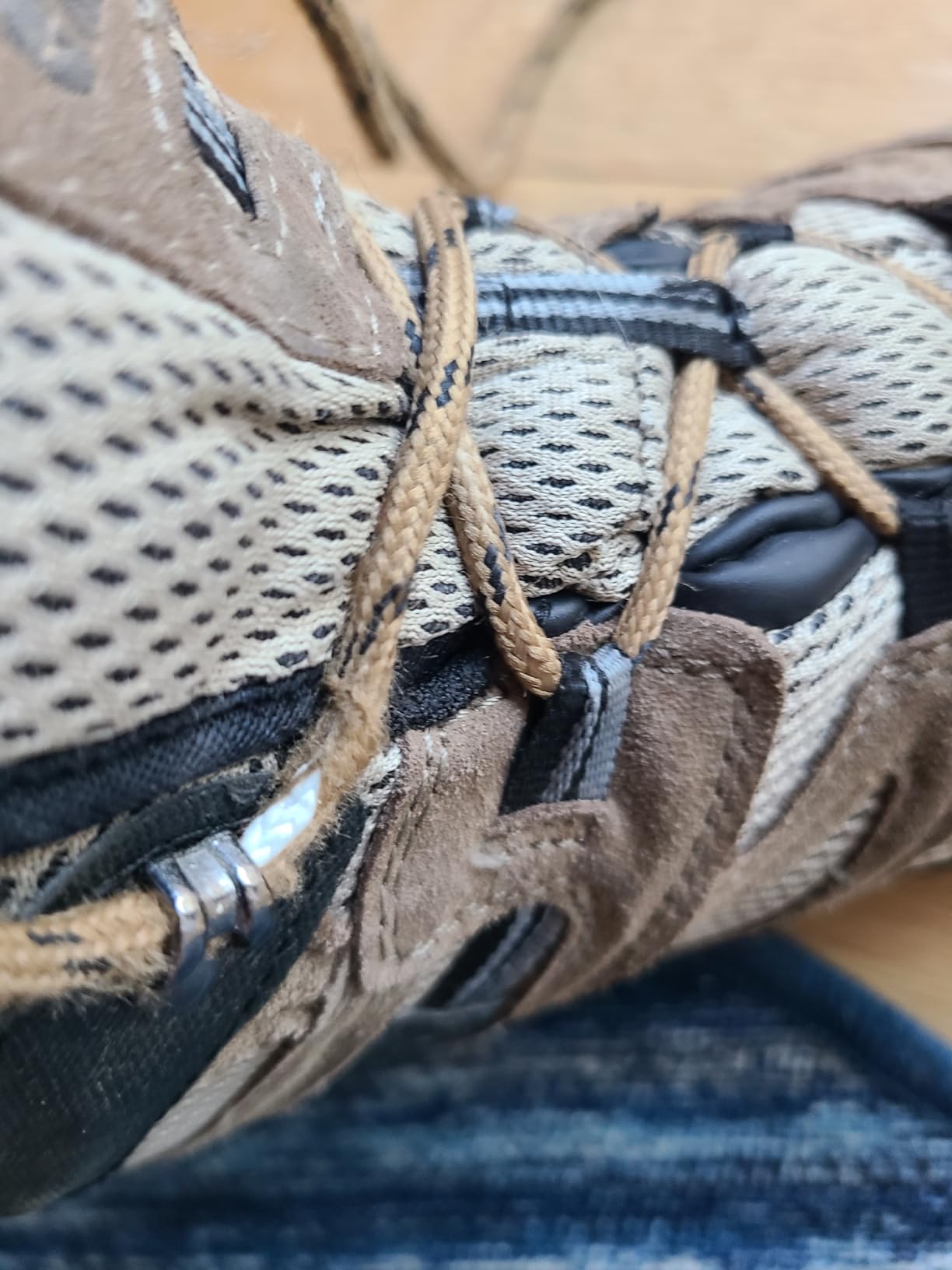 Multiple HI-TEC Ravus WP boots showing sizing options and wear patterns over time
