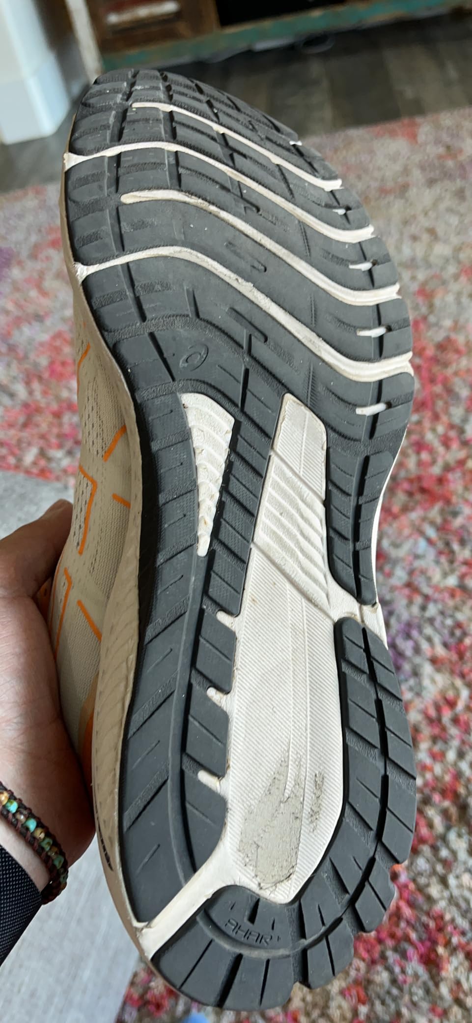 ASICS GT-1000 12 showing sole wear pattern and durability concerns