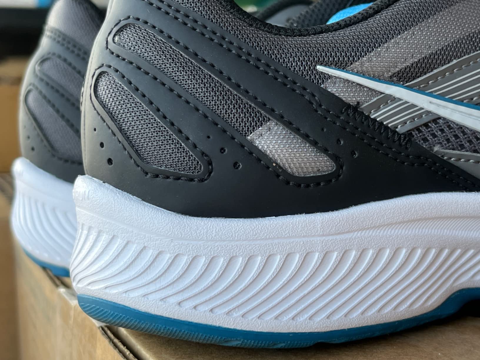 Saucony Cohesion 15 in action during road running demonstrating flexibility and ground contact
