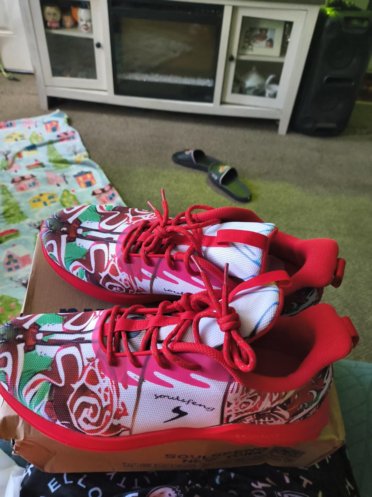Side profile of Soulsfeng sneakers showing mesh upper construction and multicolor artistic design details
