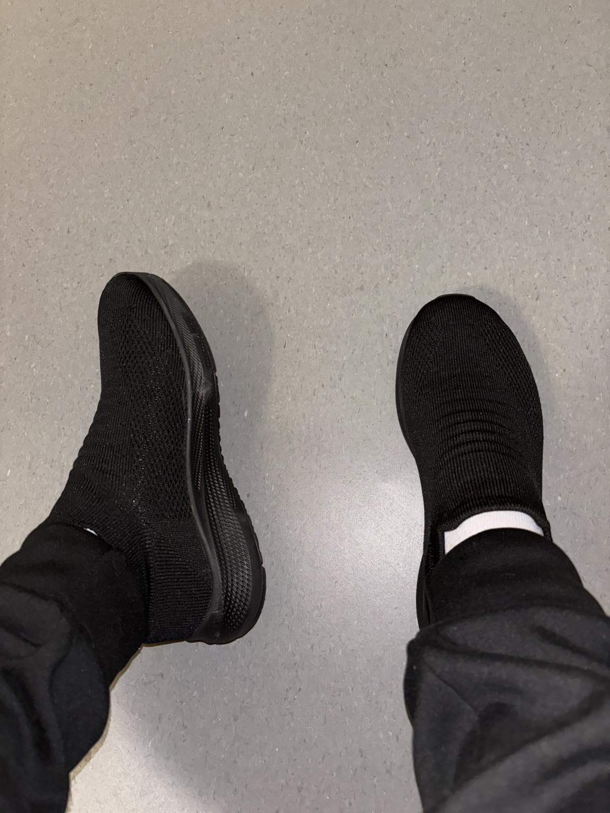 Bottom view of SHULOOK walking shoes showing rubber outsole tread pattern for realistic slip-resistance assessment