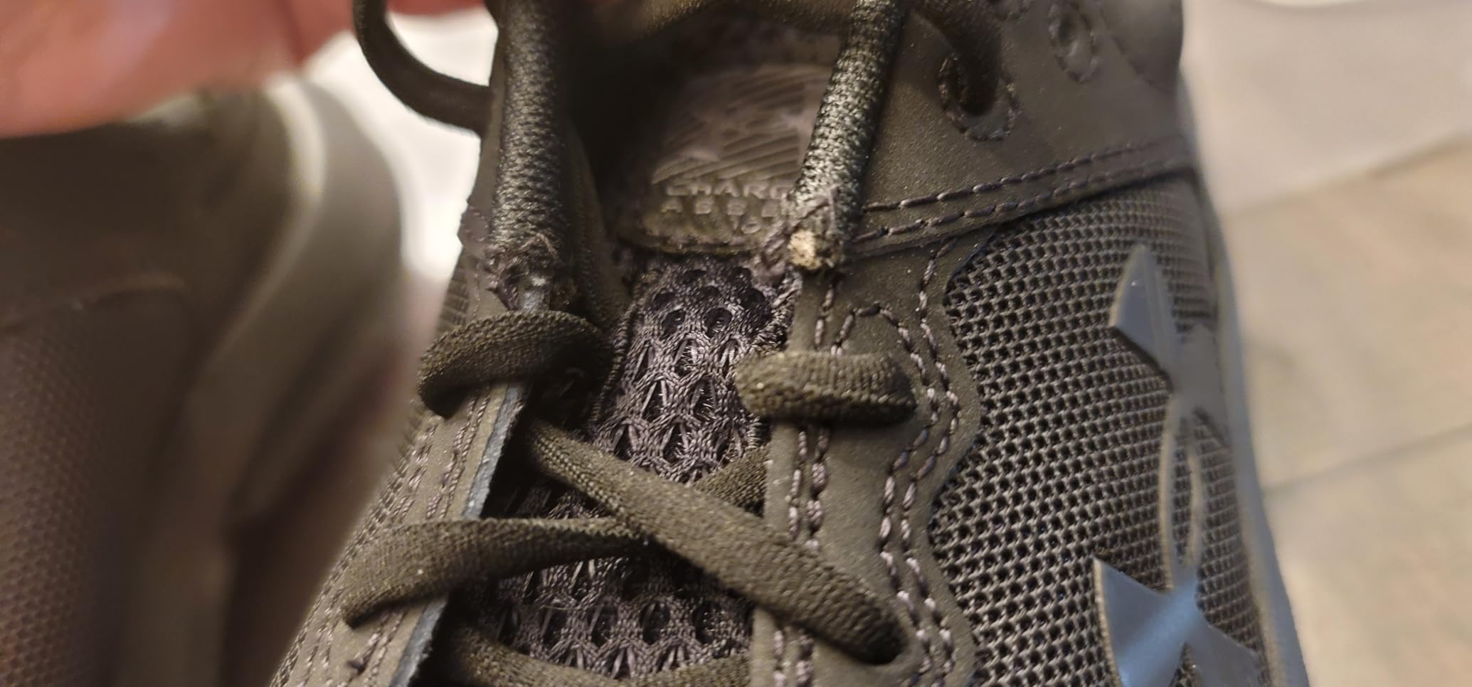 Kids wearing Under Armour Assert 10 during playground activities showing real-world testing