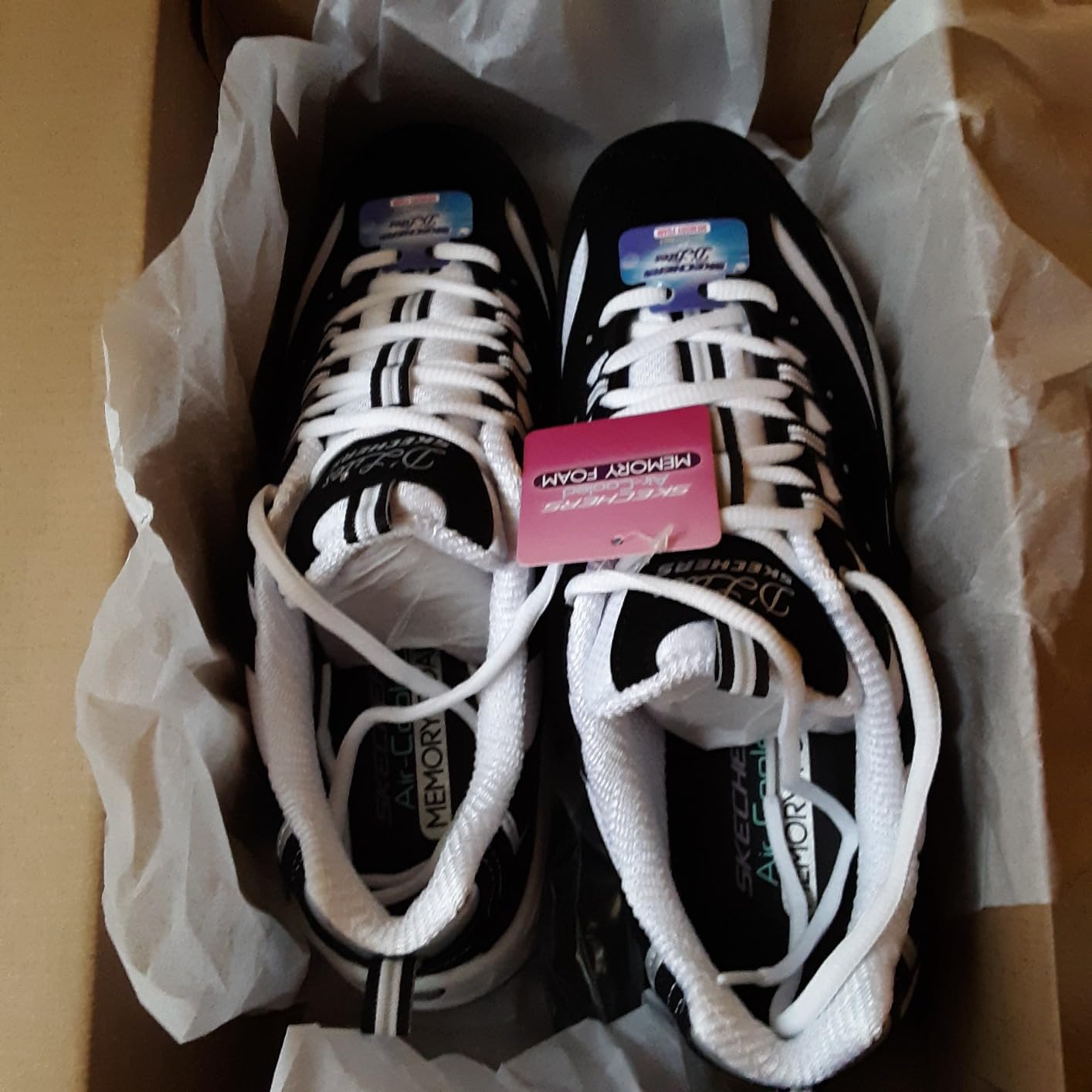 Skechers D'Lites showing stylish details including rhinestone accents and quality lacing system