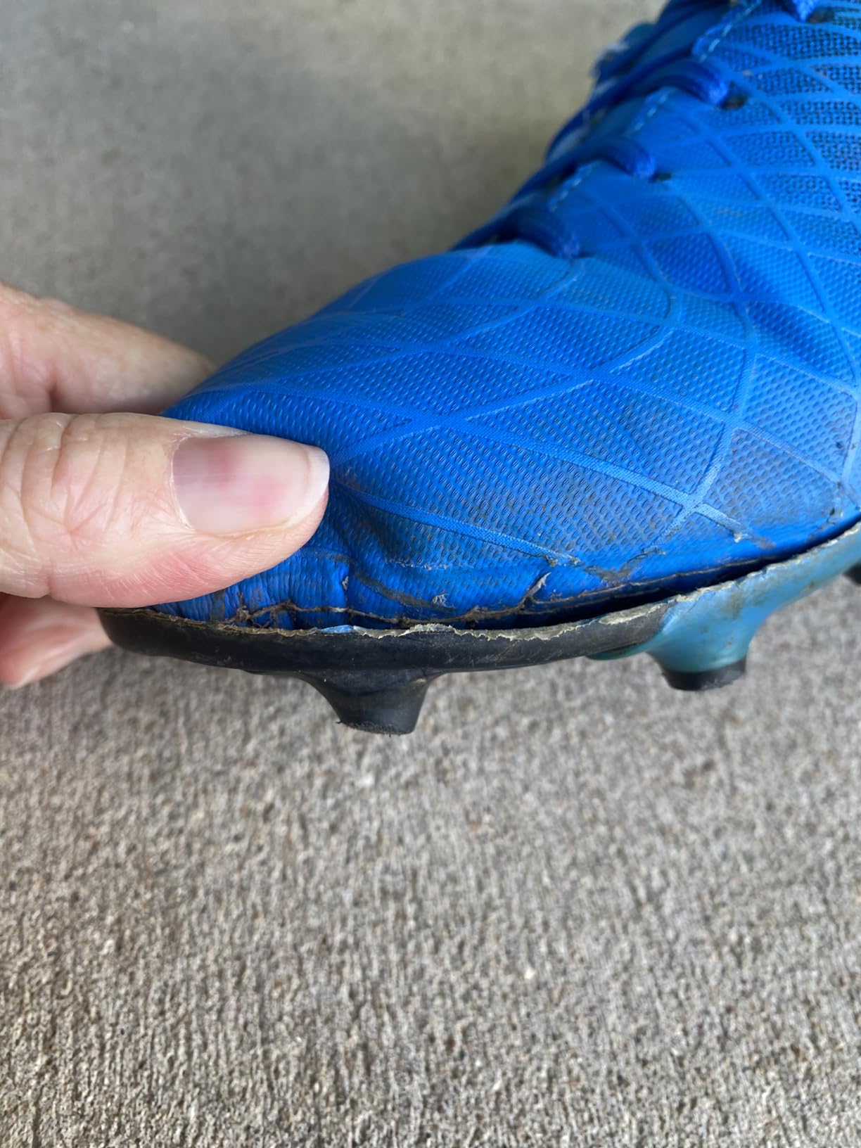 Customer photo highlighting outsole peeling and wear after a short period of use