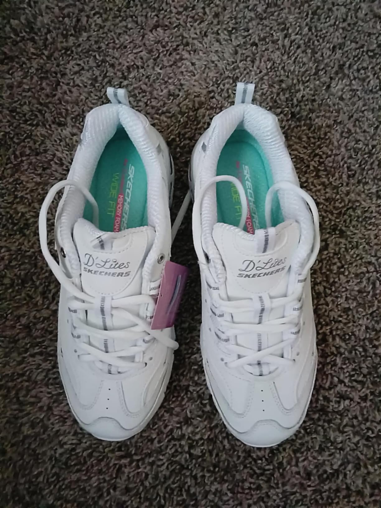 Close-up of Skechers D'Lites upper construction showing leather texture and stitching detail