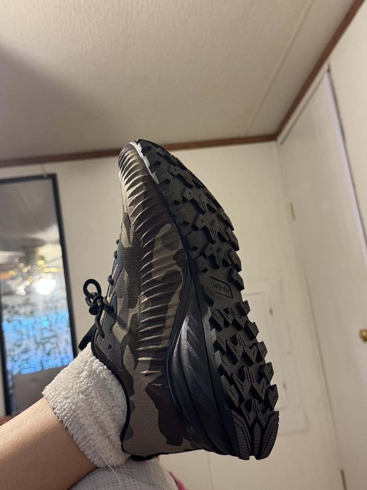 ikunka outsole showing natural rubber construction with flexible groove pattern and traction design