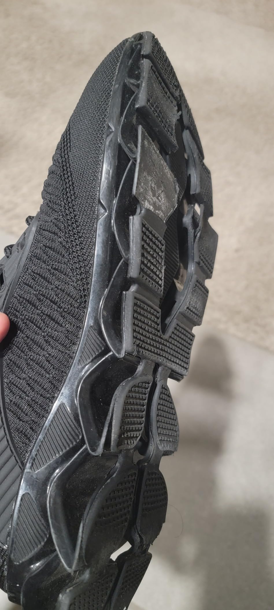Kapsen Men's Running Shoes detailed upper construction showing knitted fabric design
