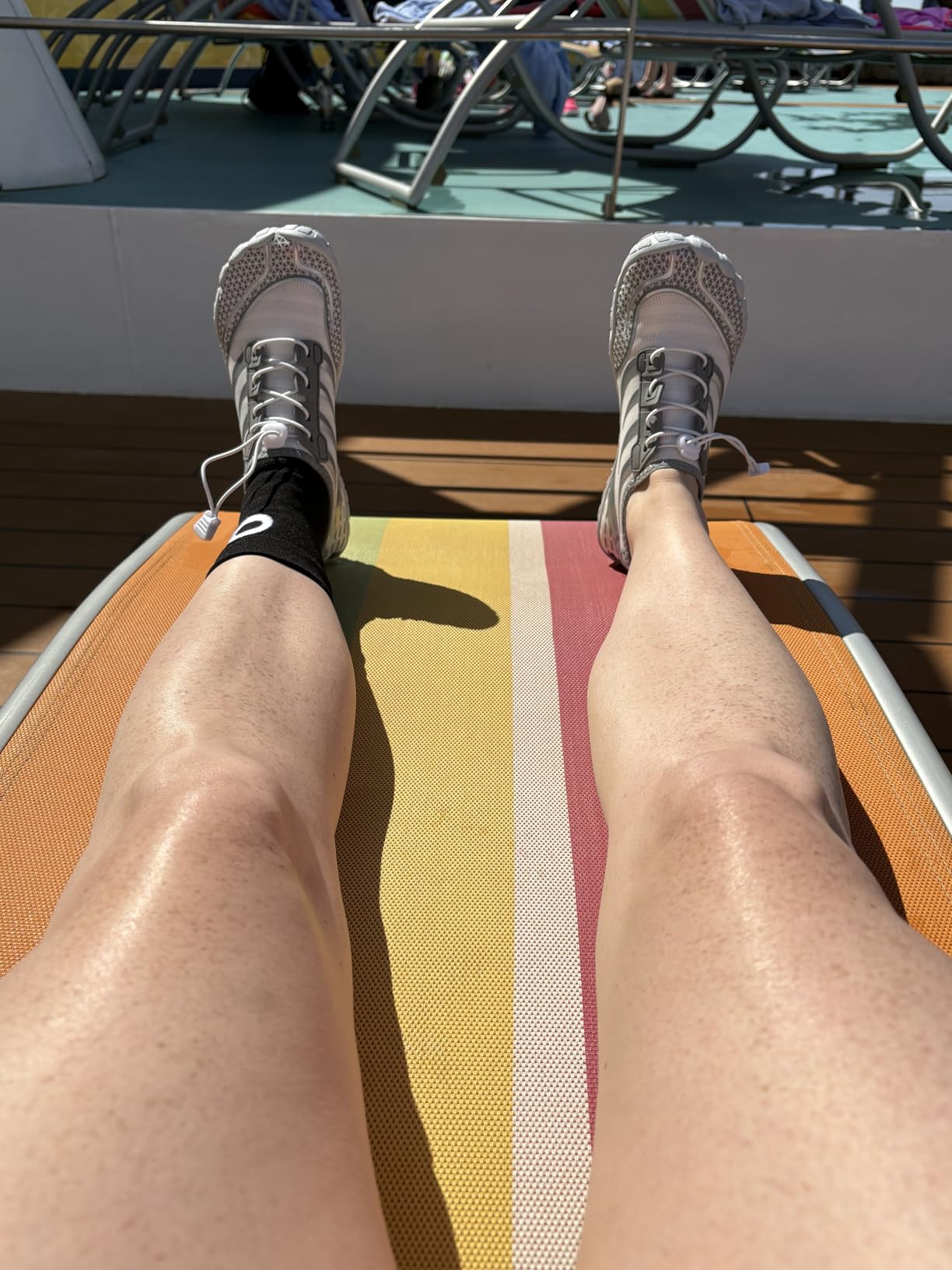 Person wearing Ziitop water shoes on cruise vacation deck showing real-world casual use scenario