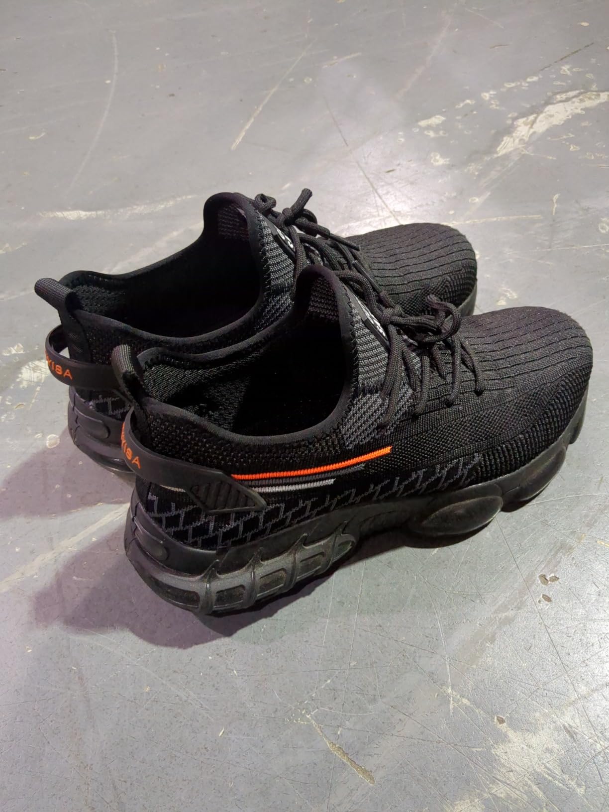 Steel toe work shoes breathable mesh upper and steel toe cap detail close-up