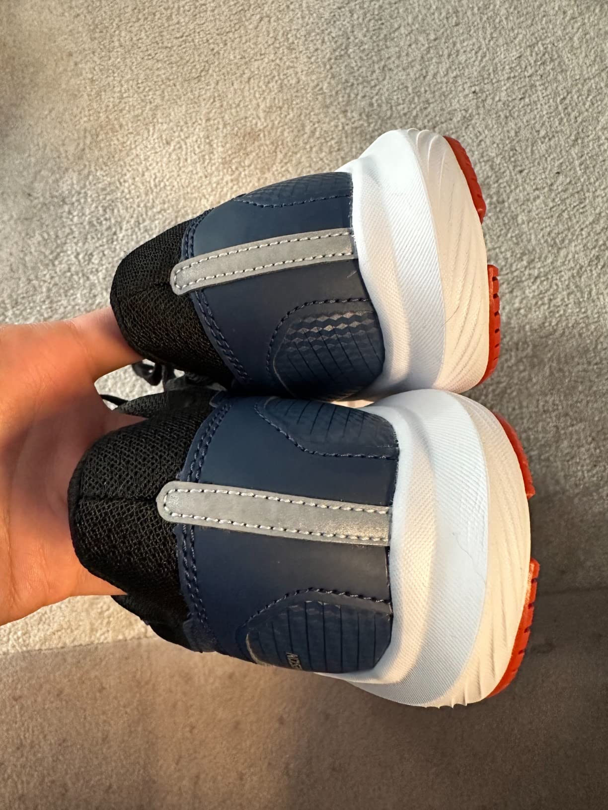 Close-up view of Saucony Cohesion 16 mesh upper showing lacing system, padded tongue, and breathable construction detail