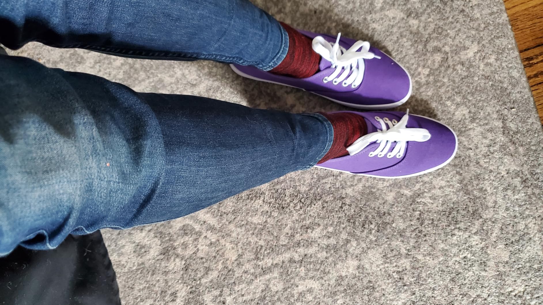 Close-up detail of TUOPIN canvas sneaker showing upper texture and metal eyelets