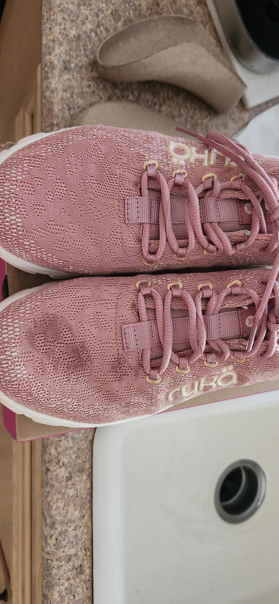 Ryka Devotion X anatomical insole removed from shoe, showing arch support contour and cushioning zones