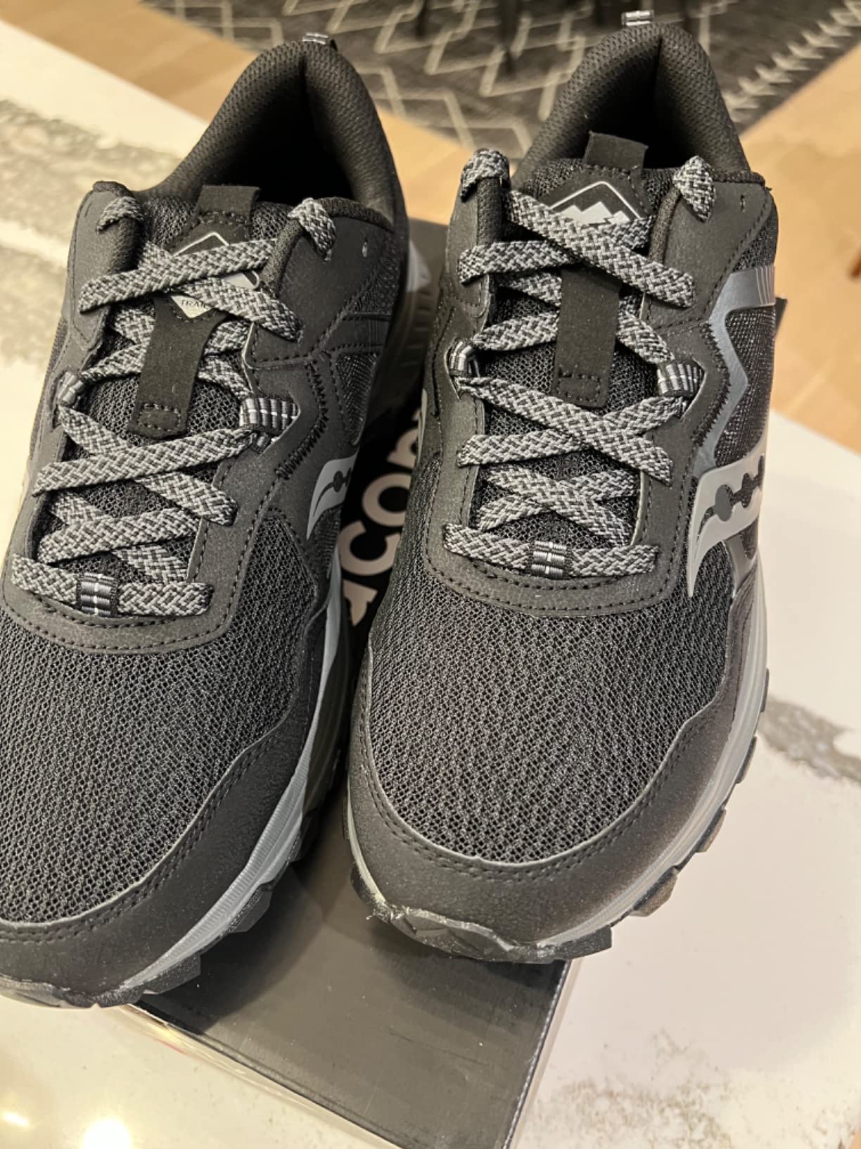 Saucony TR16 outsole showing multi-directional carbon rubber lug pattern with 4.5mm lug height and debris-shedding spacing