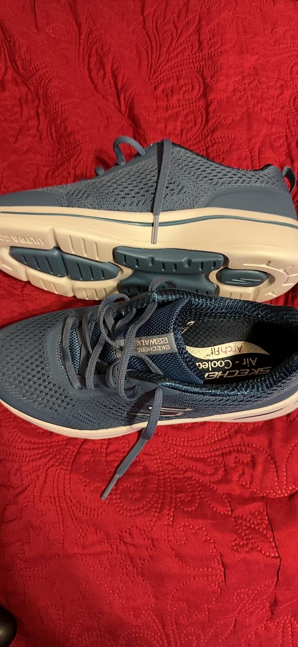 Detail view of Skechers Arch Fit insole system showing podiatrist-certified arch support cushioning technology inside shoe