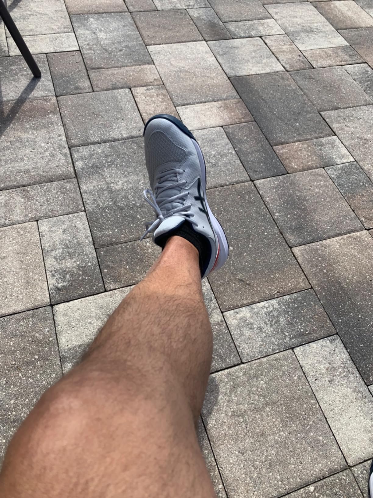 ASICS Gel-Dedicate 8 on tennis court during baseline play showing court performance