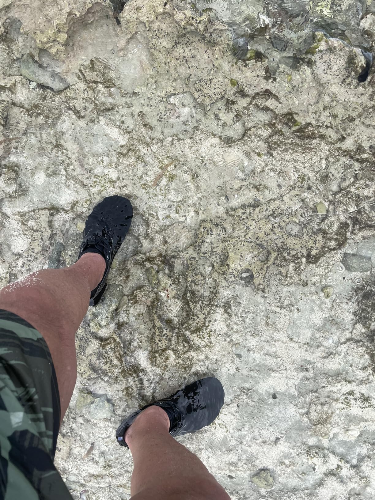 Ziitop water shoes on rocky beach surface showing traction and practical recreational use in outdoor environment