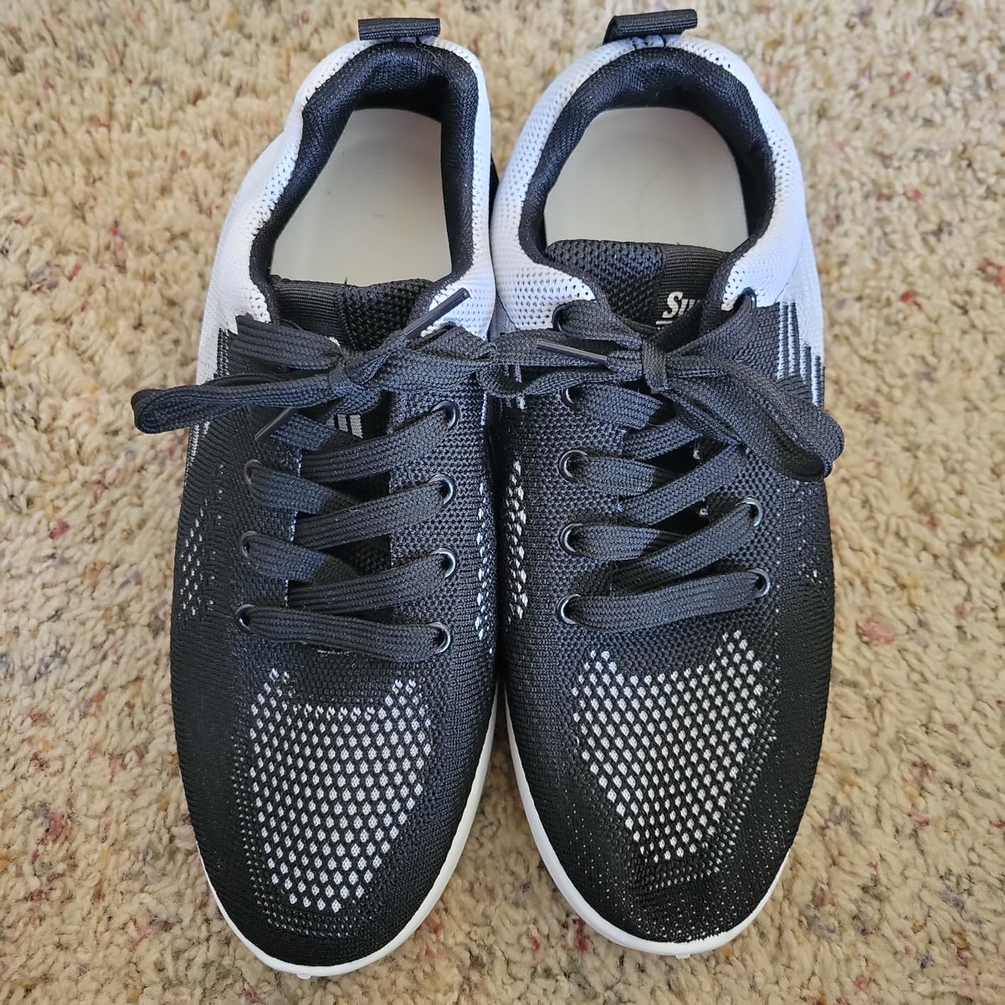 Close-up detail of Padgene sneaker mesh upper showing breathability construction and material quality