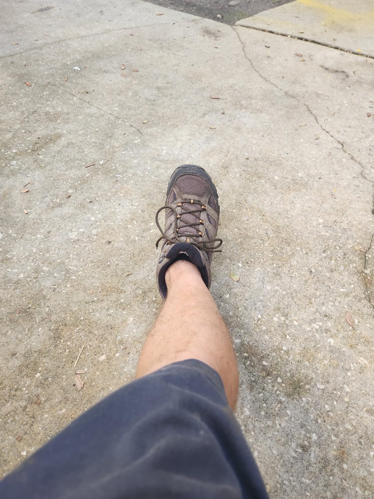 Merrell Moab 3 boots being tested in wet conditions showing waterproof performance during water exposure