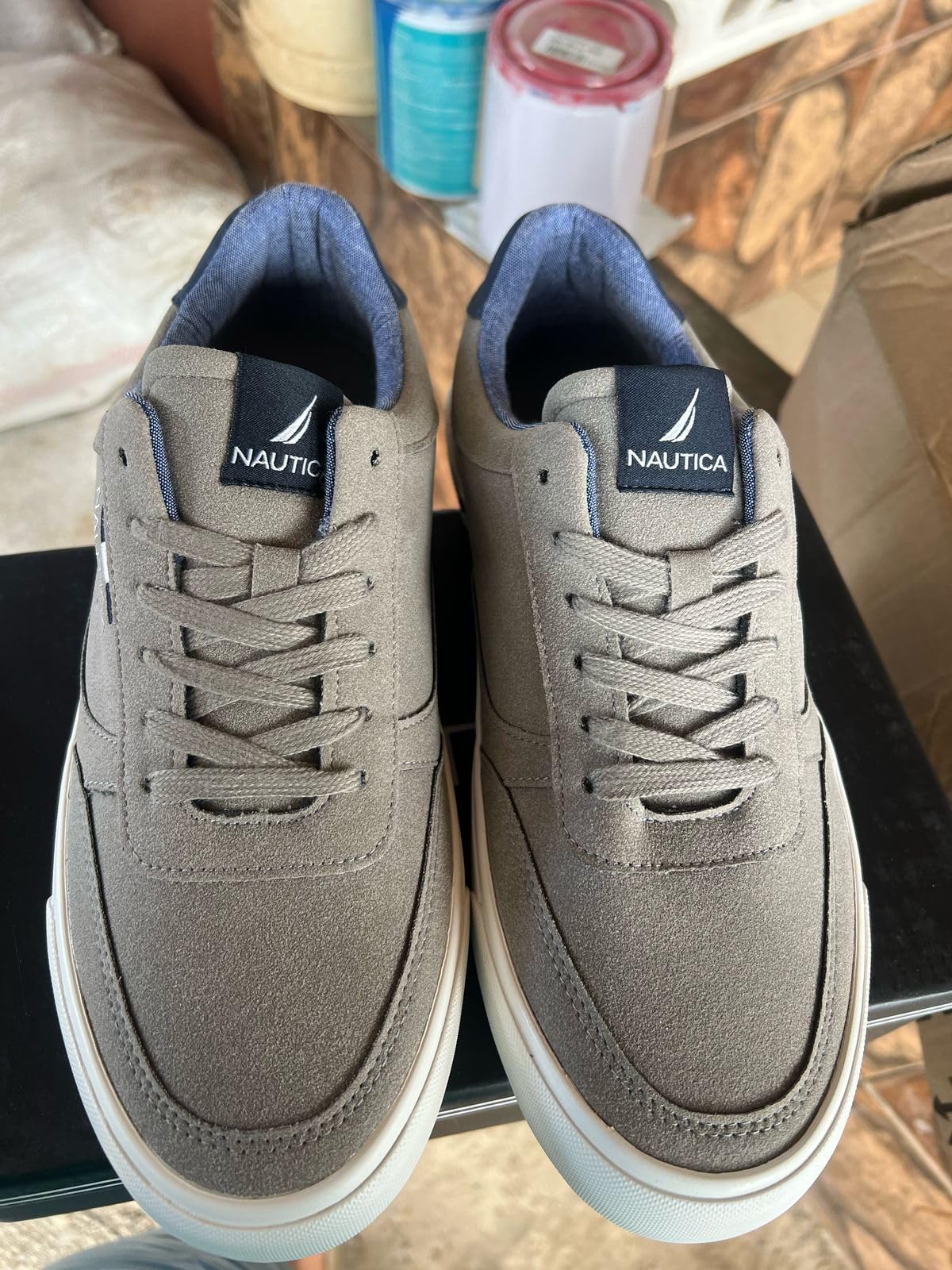 Close-up detail of Nautica casual shoe showing lace-up construction and faux leather upper stitching pattern