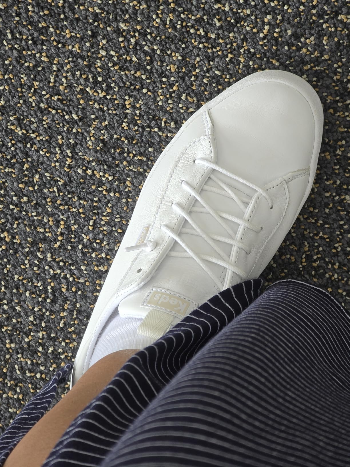 Side view of Keds Kickback Canvas Slip-On showing low-profile silhouette and canvas upper