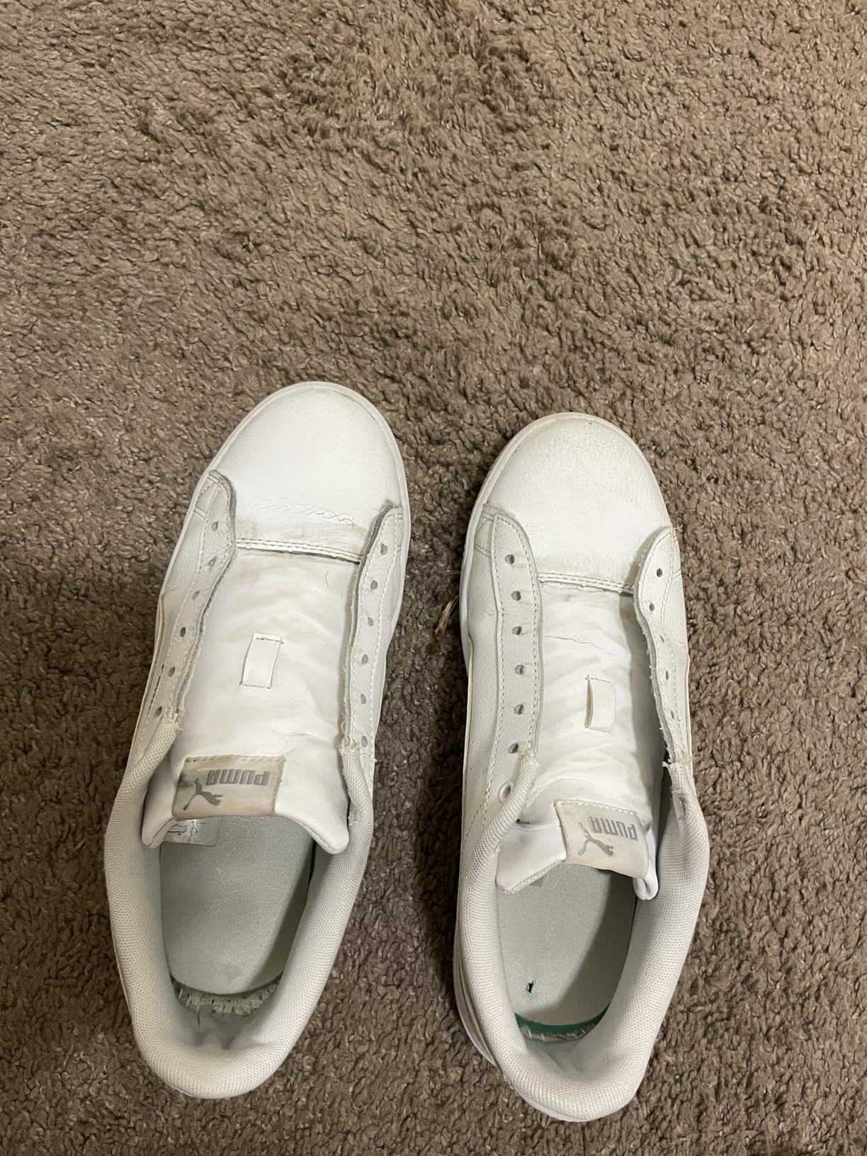Before and after comparison of white sneaker rubber sole showing dramatic cleaning improvement from SneakERASERS
