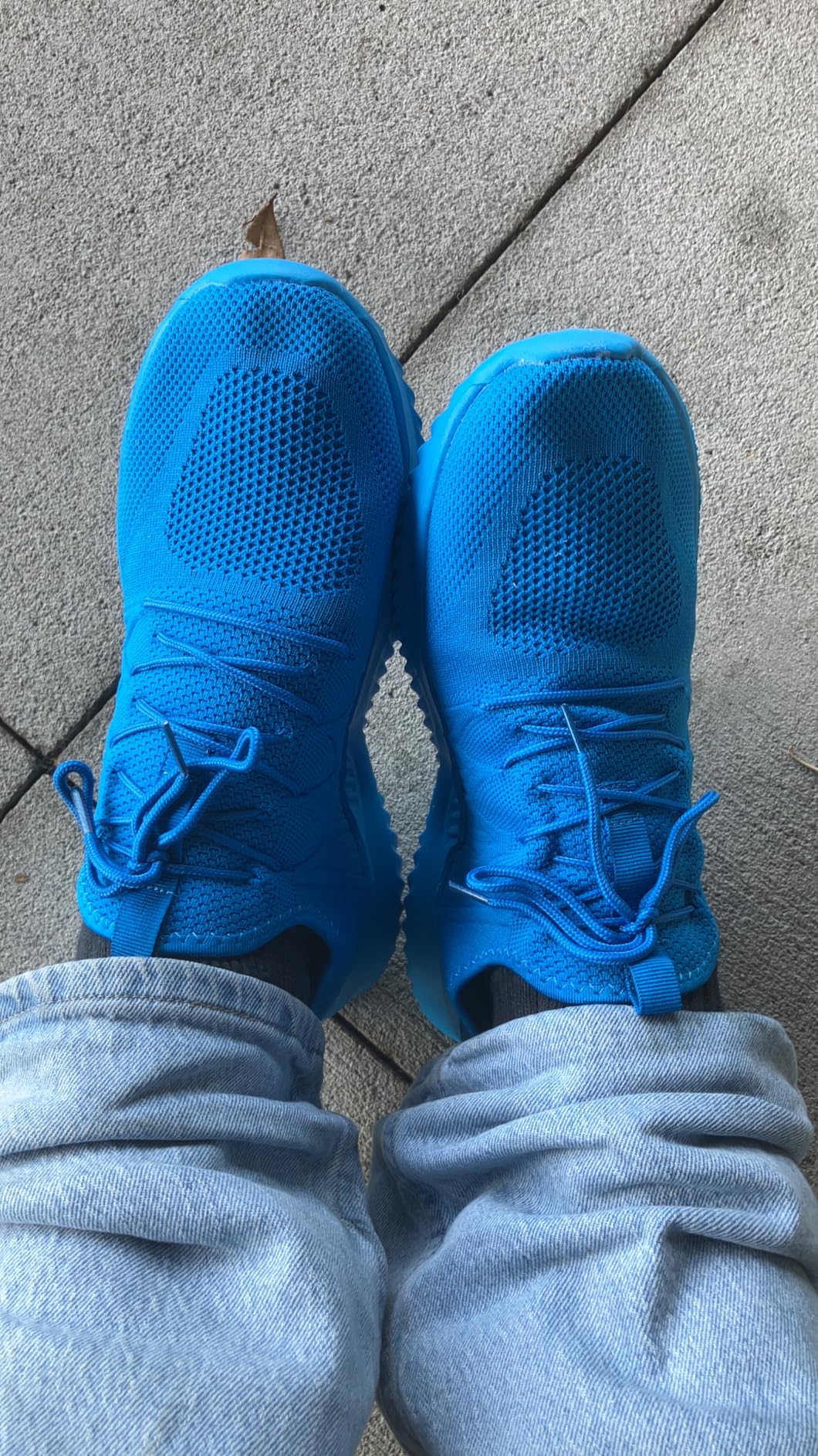 Close-up view of mesh knit upper construction showing breathable design and decorative lace pattern