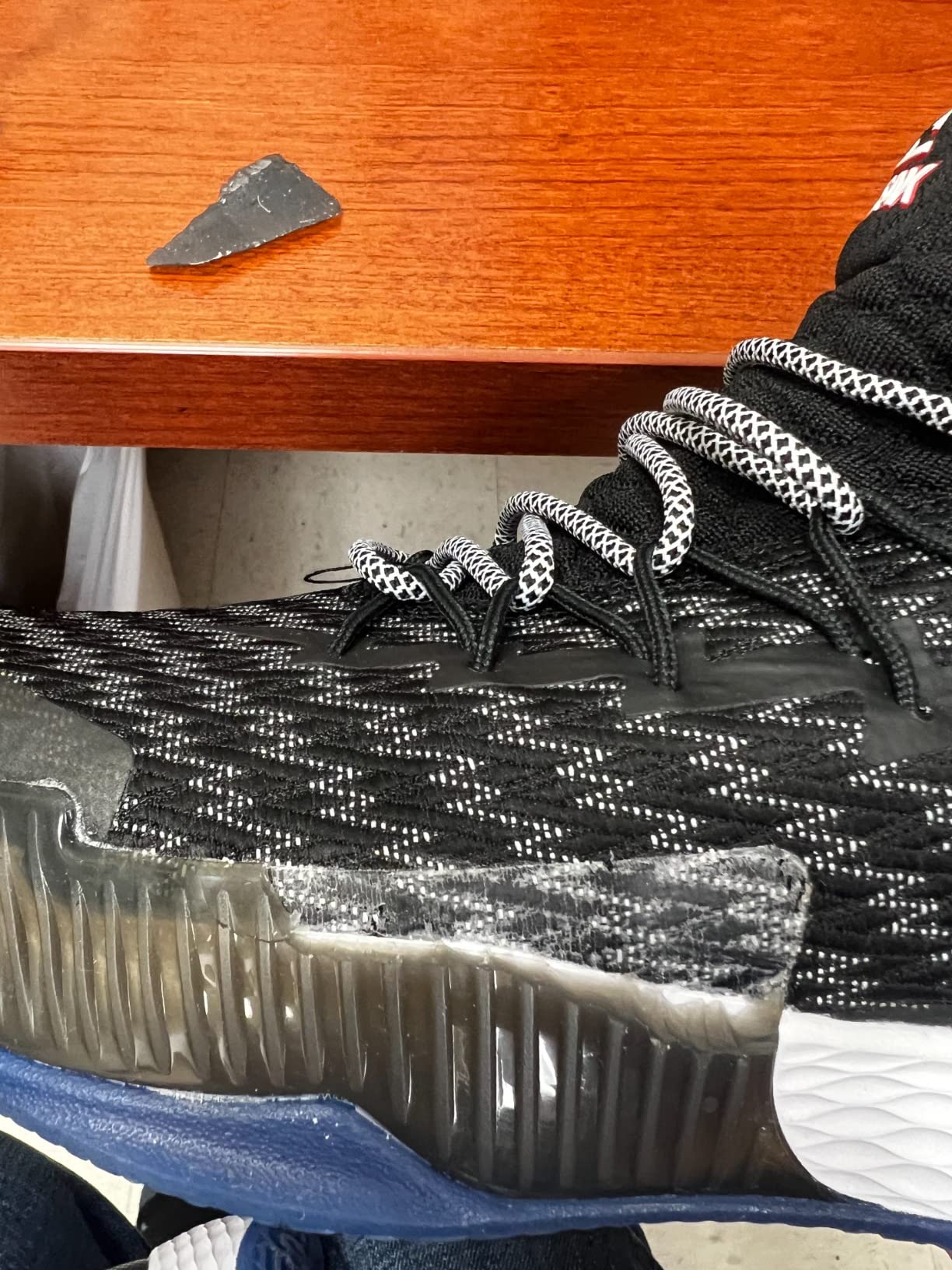 PEAK basketball shoe durability failure showing rubber separation from upper at sole junction