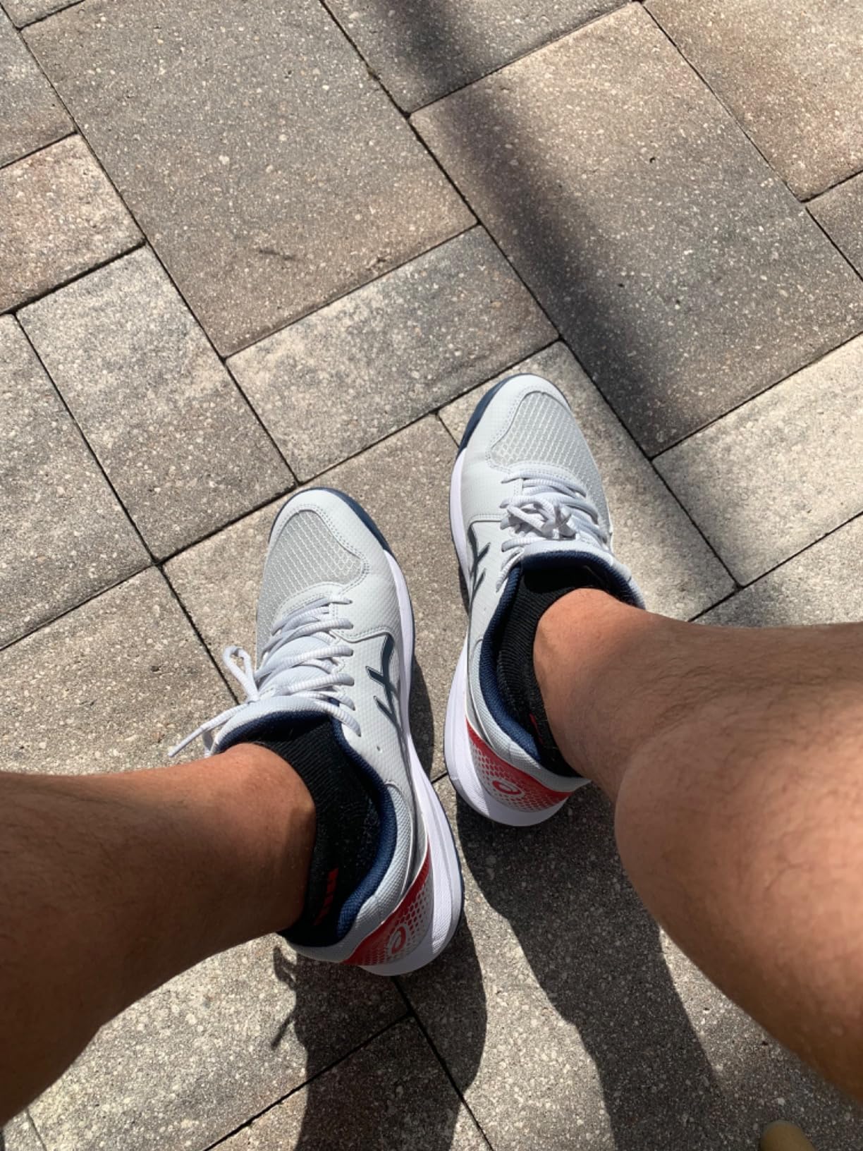 ASICS Gel-Dedicate 8 action shot during tennis match showing traction in play
