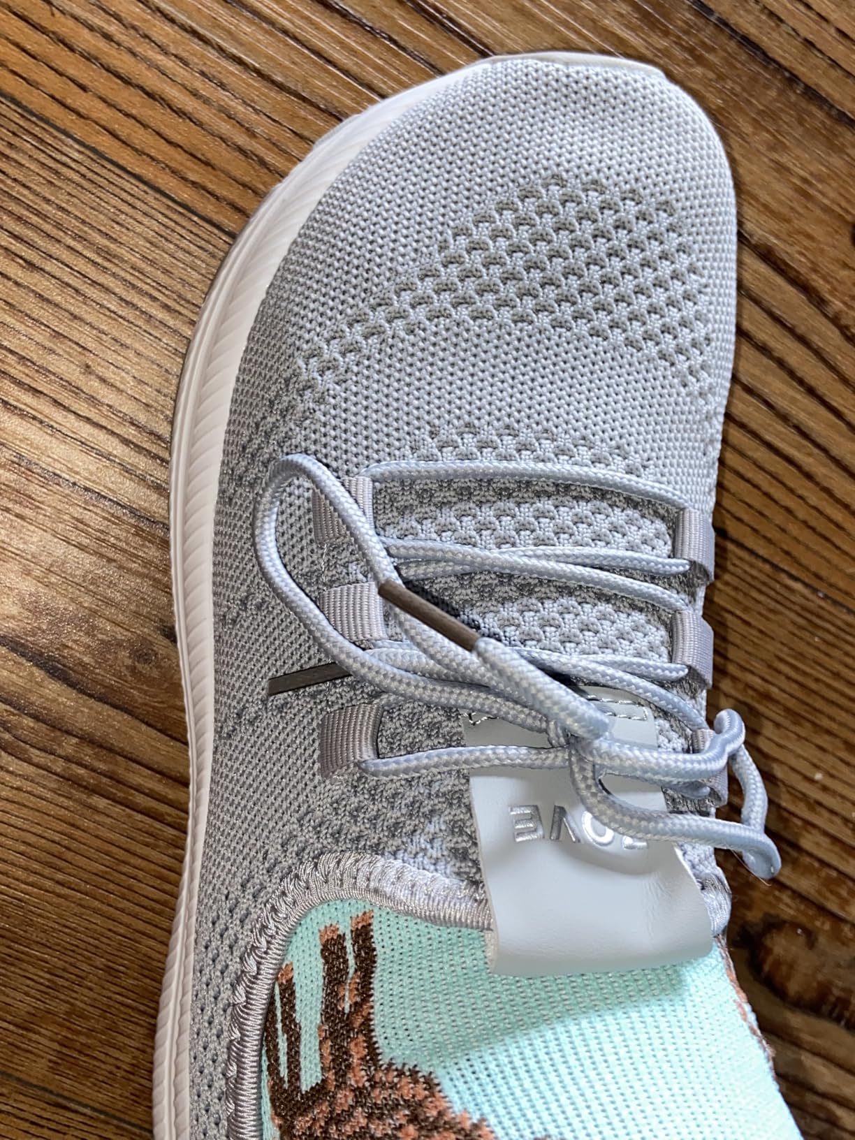 Bottom view of ZOVE shoes showing slip-resistant sole pattern with TPU patches and cushioning technology