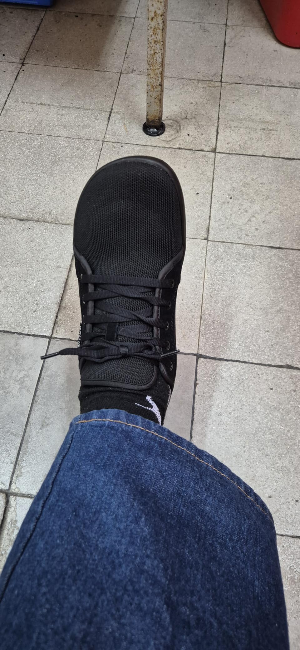 Bottom view of WHITIN barefoot sneakers showing rubber tread pattern and sticky-grip outsole