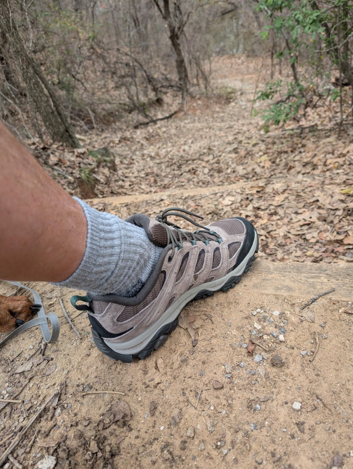 Merrell Moab 3 hiking shoes on rocky granite trail terrain showing Vibram outsole grip in real conditions