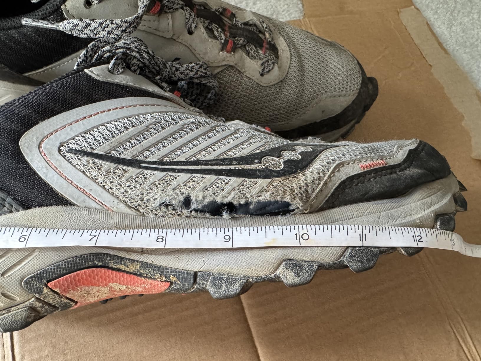 Saucony TR15 showing extensive sole and upper separation after moderate trail use demonstrating durability concerns