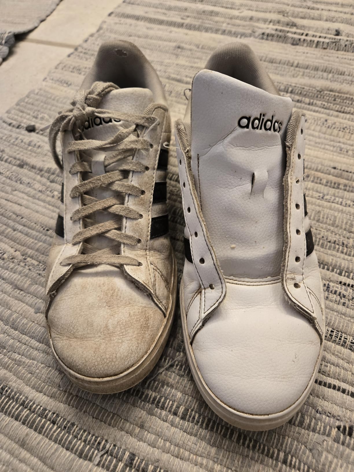 After photo showing significantly improved white areas on soccer cleats after SneakERASERS treatment