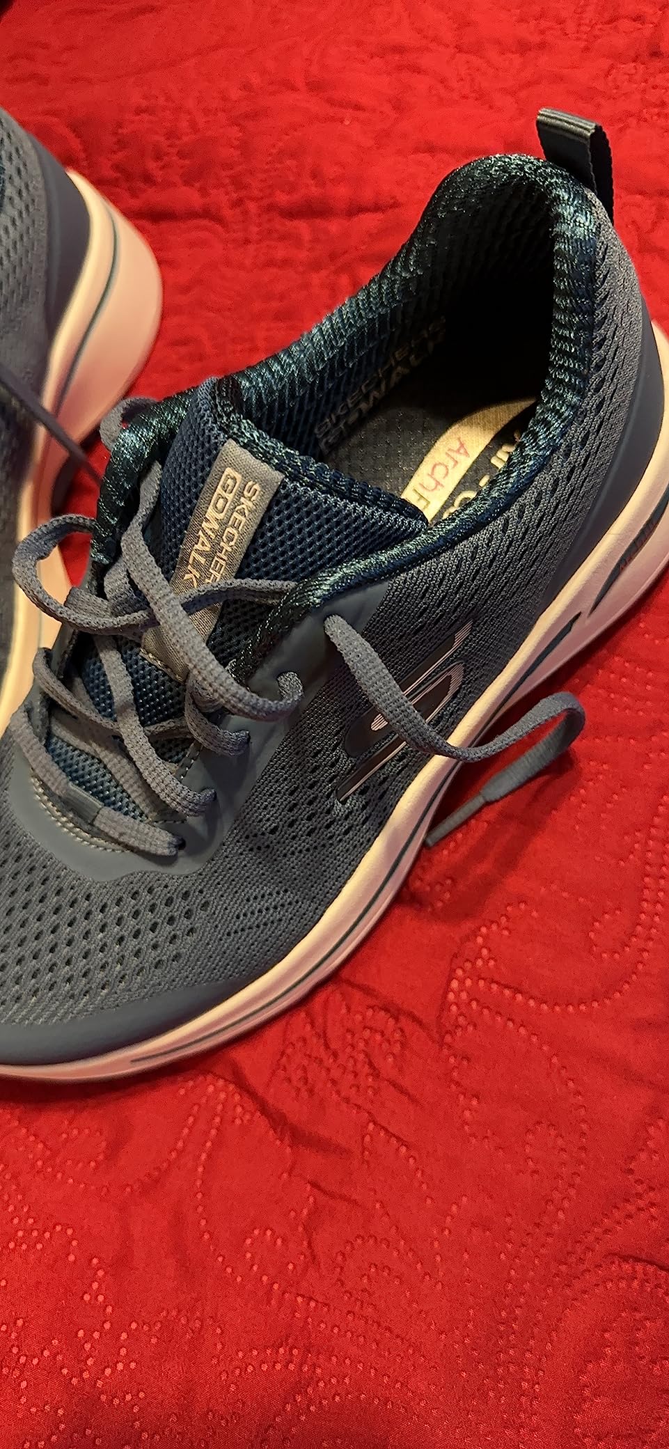 Skechers Go Walk Arch Fit showing midsole cushioning technology and responsive foam structure