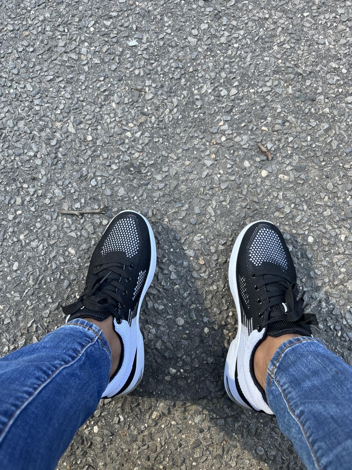 Bottom sole view of Padgene women's sneakers showing EVA foam construction and rubber traction pattern