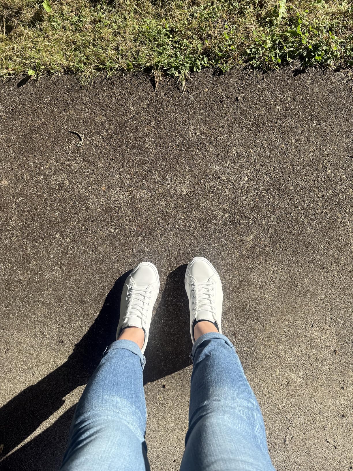SERNIAL white tennis shoes after four weeks of testing showing maintained appearance and minor wear