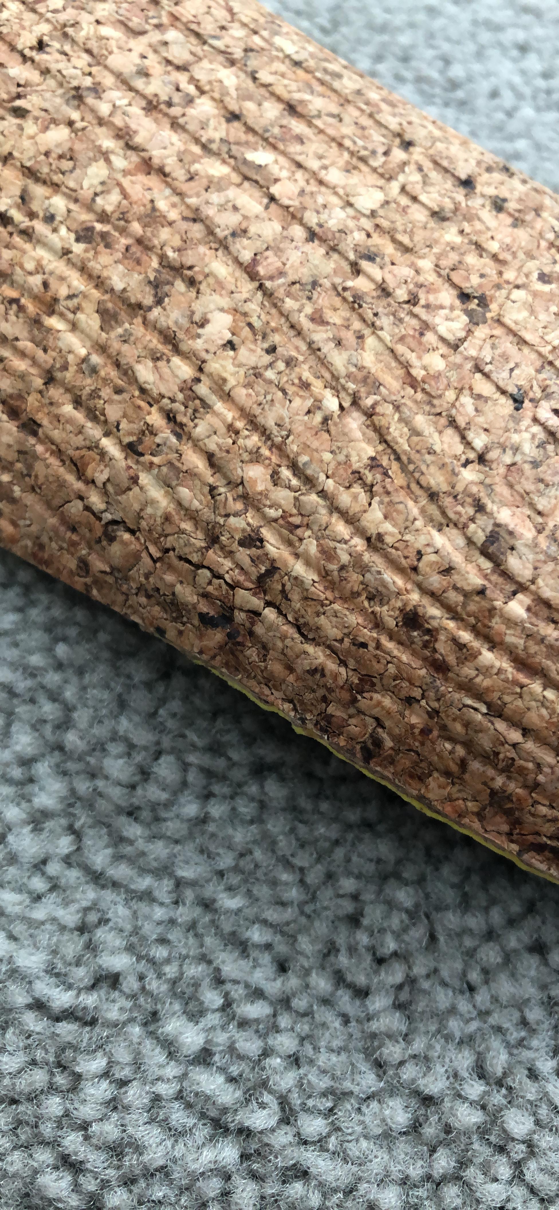 Close-up of SOLE ReCORK material showing natural cork grain and heat-responsive base structure